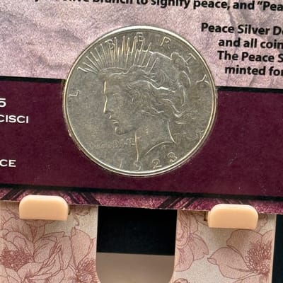 1923-s peace dollar in decorative holder