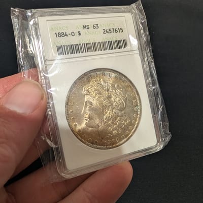 1884-O Morgan Dollar ANACS MS63 Toned Soapbox 