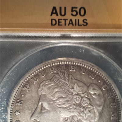 1884-S ANAC AU50 cleaned Morgan dollar