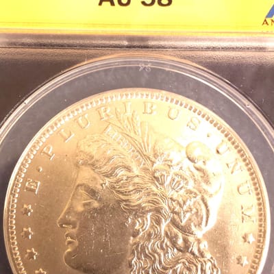 1885-O ANACS AU58 Morgan dollar