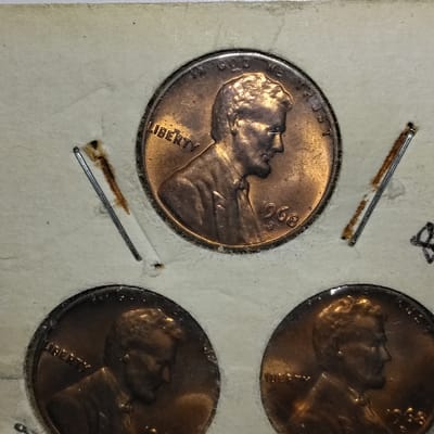 Three 1968 Lincoln cent  - additional view