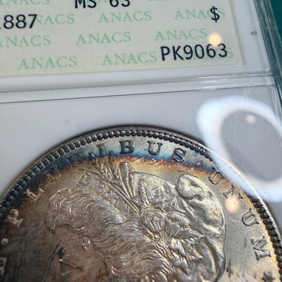 1887 Morgan Dollar Rainbow Toned ANACS MS63 - additional view