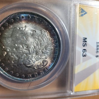 1886 P MORGAN MS63 VIVID BLUE BULLSEYE RAINBOW