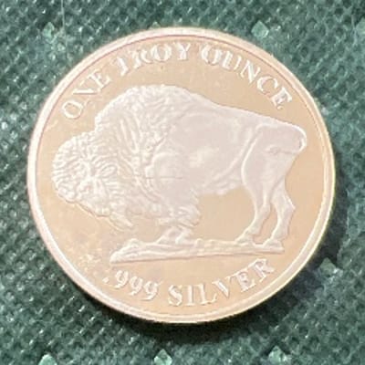 SPOT - 1 oz Buffalo Round .9999 with some milk spo - additional view