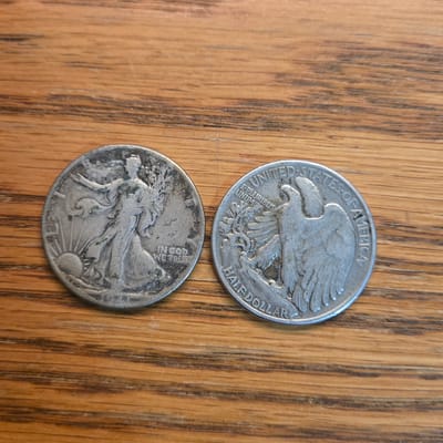 2 walking Liberty half dollars 