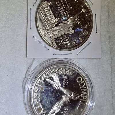 2 commeritive silver dollar
