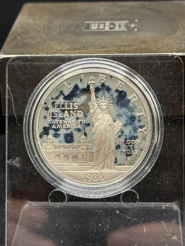 1986-S Ellis Island Commemorative in Capsule Milky - Image 1